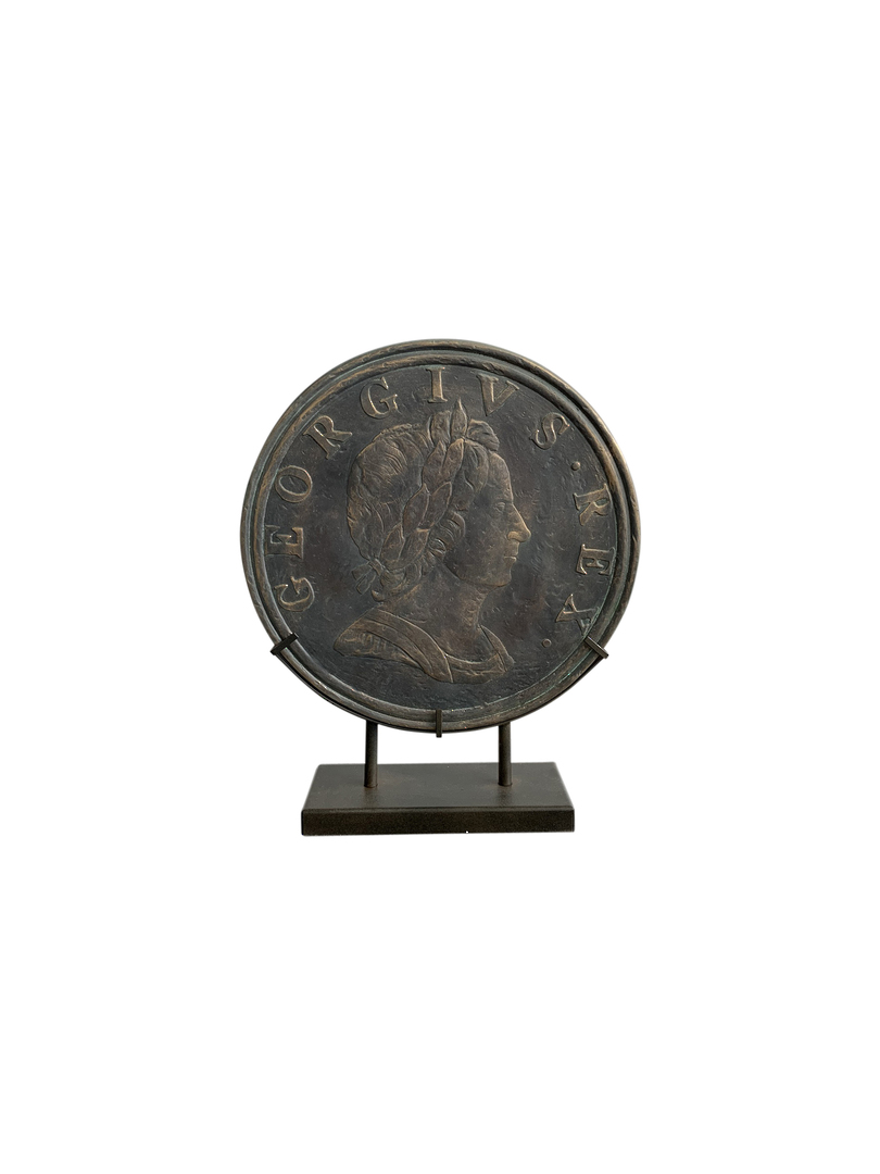ANTIQUE OLD COIN ON STAND image 1